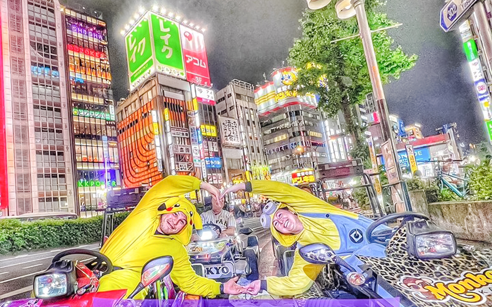 Participants in character costumes on go-karts in Tokyo's vibrant cityscape.