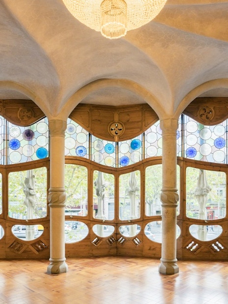 Casa Batlló interior with stained glass windows and unique architectural design in Barcelona.