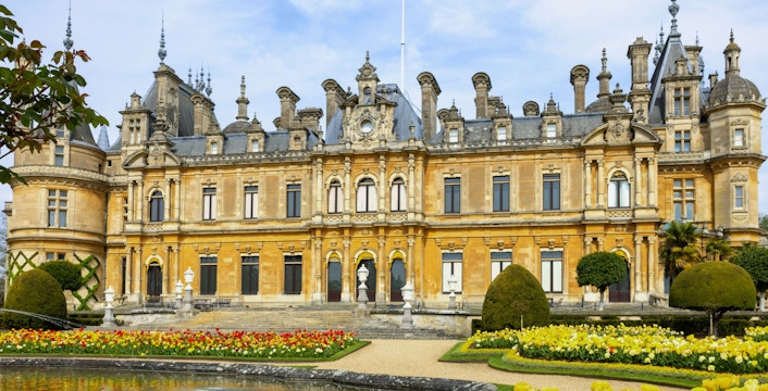 Manor in Waddesdon, Buckinghamshire with ornate architecture and landscaped gardens.