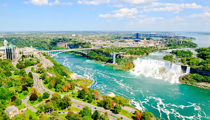 Niagara Falls panoramic view with cascading waterfalls and mist, showcasing the natural beauty of this iconic landmark.