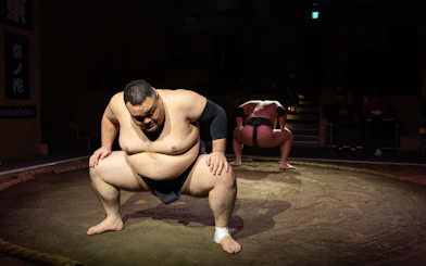 Sumo wrestlers preparing for a match at Kyoto Sumo Entertainment Show.