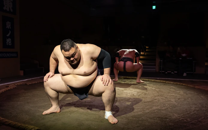 Sumo wrestlers preparing for a match at Kyoto Sumo Entertainment Show.