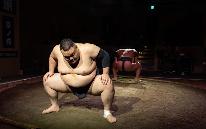 Sumo wrestlers preparing for a match at Kyoto Sumo Entertainment Show.