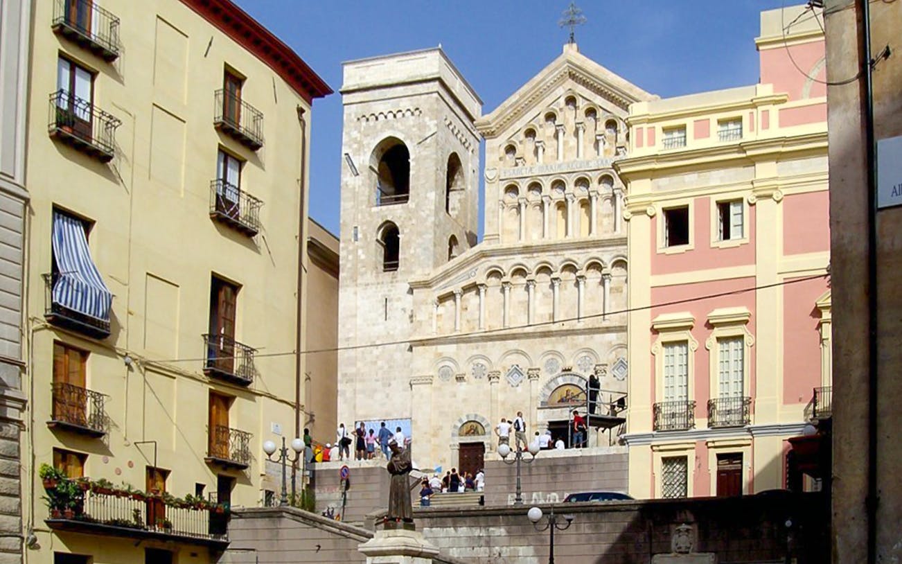 Castello District walking tour with historic architecture and cathedral in the background.