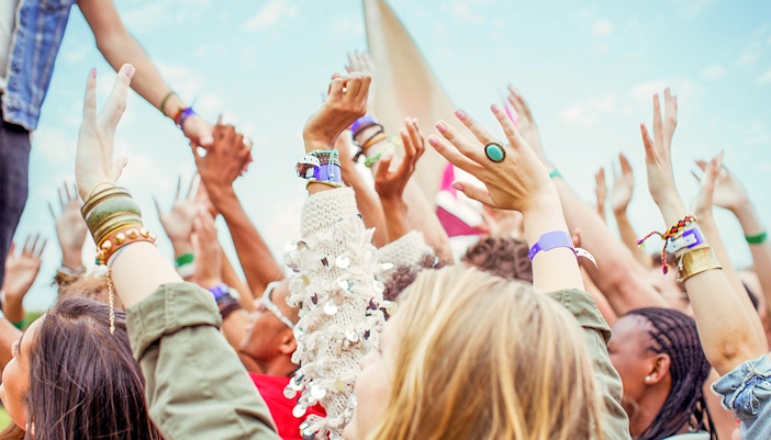 Canal view with boats and historic buildings in Amsterdam during July.