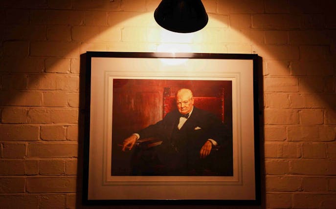 Portrait of Winston Churchill in the Churchill War Rooms, London.