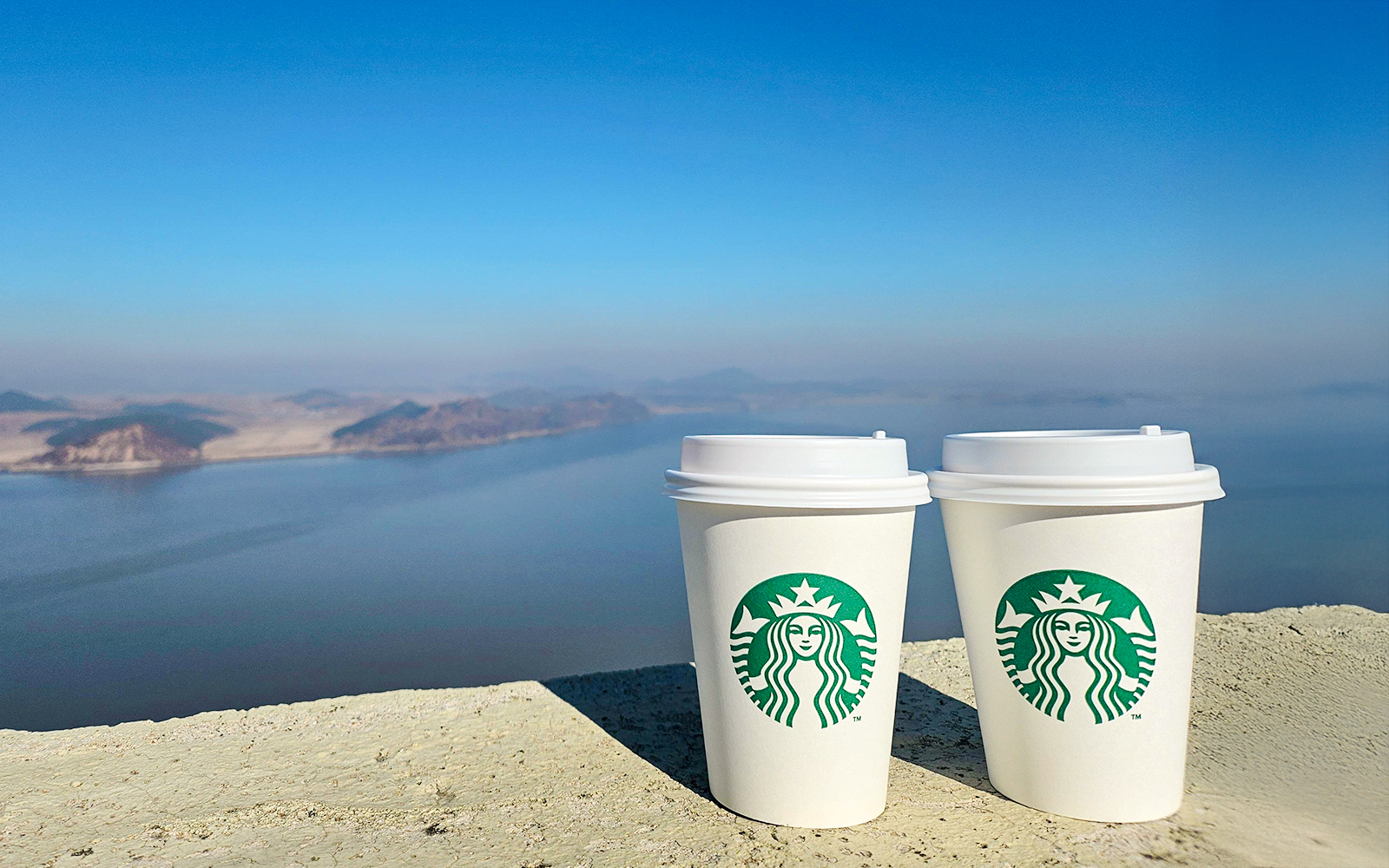 Starbucks coffee cups at Aegibong Observatory overlooking DMZ, South Korea.