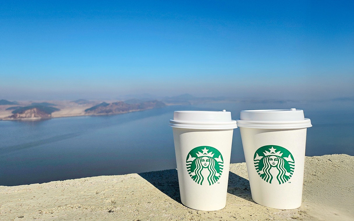 Starbucks coffee cups at Aegibong Observatory overlooking DMZ, South Korea.