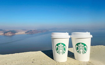 Starbucks coffee cups at Aegibong Observatory overlooking DMZ, South Korea.