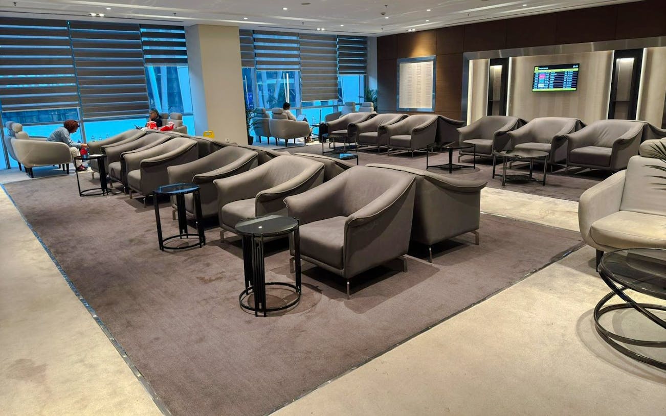 Sofa and chairs in Plaza Premium Lounge, Cairo airport seating area.