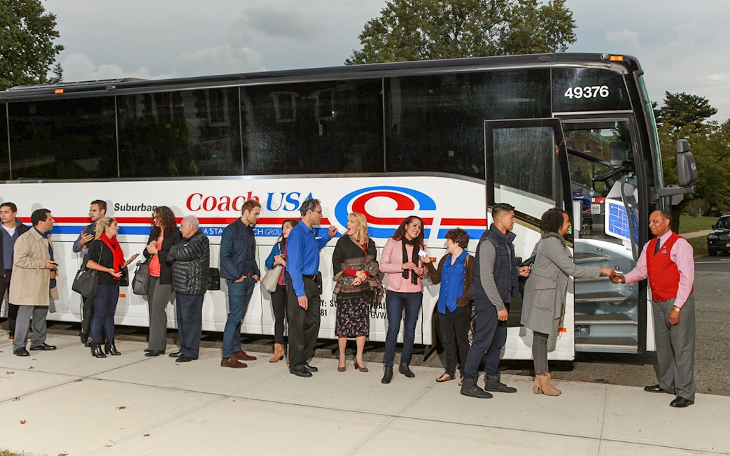 Passengers boarding Coach USA bus from Chicago O'Hare to Milwaukee.