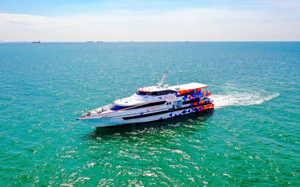 Ferry traveling from Singapore to Batam across the blue sea.