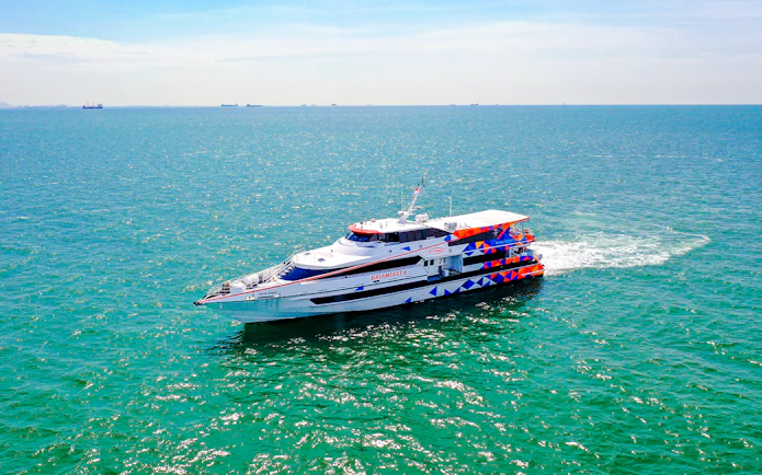Ferry traveling from Singapore to Batam across the blue sea.