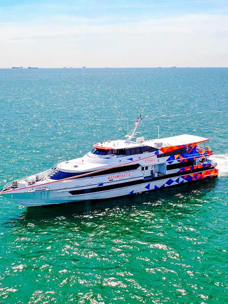 Ferry traveling from Singapore to Batam across the blue sea.
