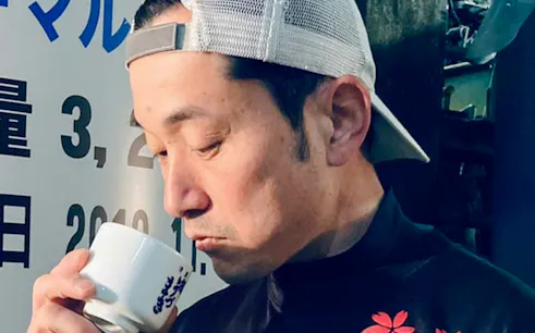Man tasting sake at Sakura Uzumaki Brewery, Matsuyama, Ehime.