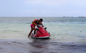 Person preparing for a jet-ski ride at Diani Beach, Kenya.
