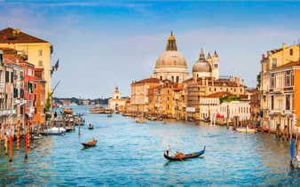 Gondolas on the Grand Canal with Santa Maria della Salute in Venice.