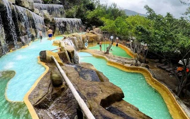 Water park with cascading pools and rock formations, Cai River View, Dubai.