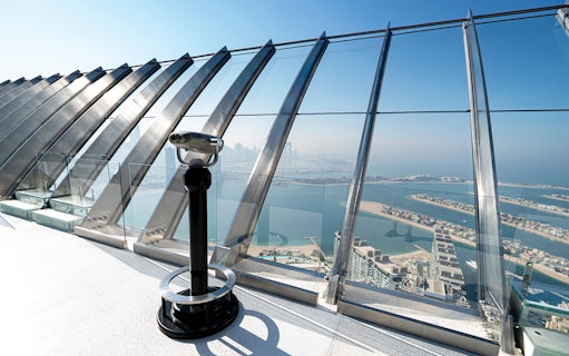 Telescope on observation deck overlooking Palm Jumeirah from Palm Tower, Dubai.