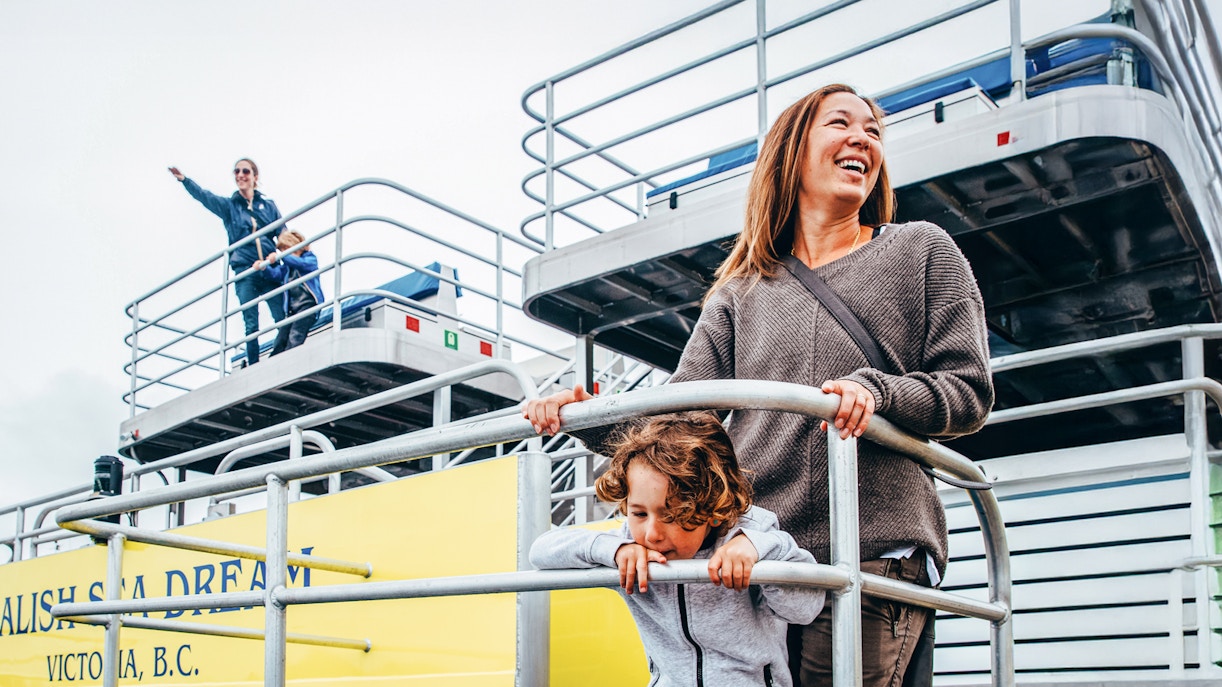 Family enjoying the view from the top deck of a boat in Victoria, B.C.