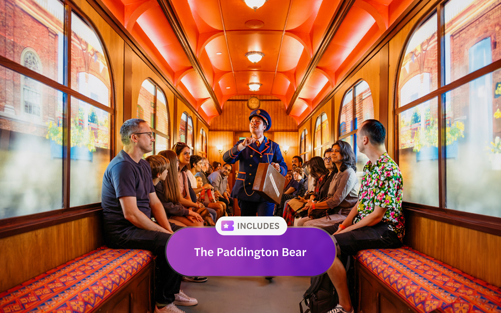 Children and families on a train during The Paddington Bear Experience in London, enjoying storytelling.