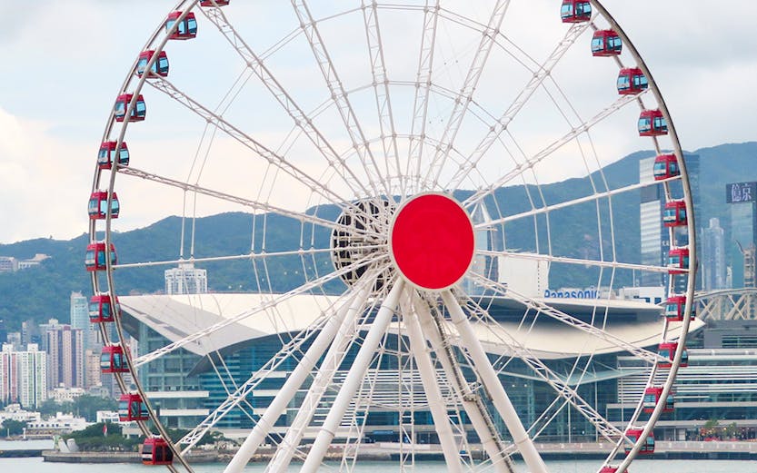 Hong Kong Observation Wheel with city skyline in the background.