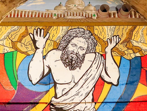 Mural of Atlas holding up the world in Bourbon Tunnel, Naples.