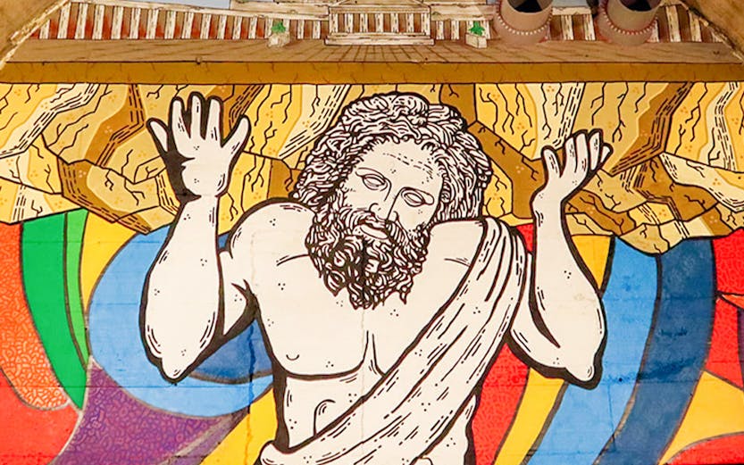 Mural of Atlas holding up the world in Bourbon Tunnel, Naples.