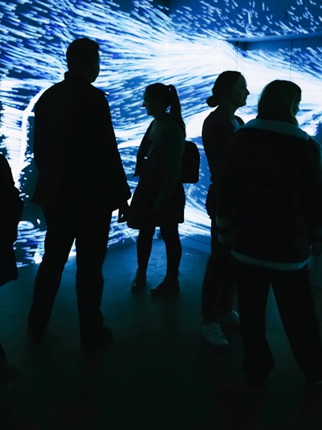 Visitors exploring digital art installation at Lift 109, Battersea Power Station.