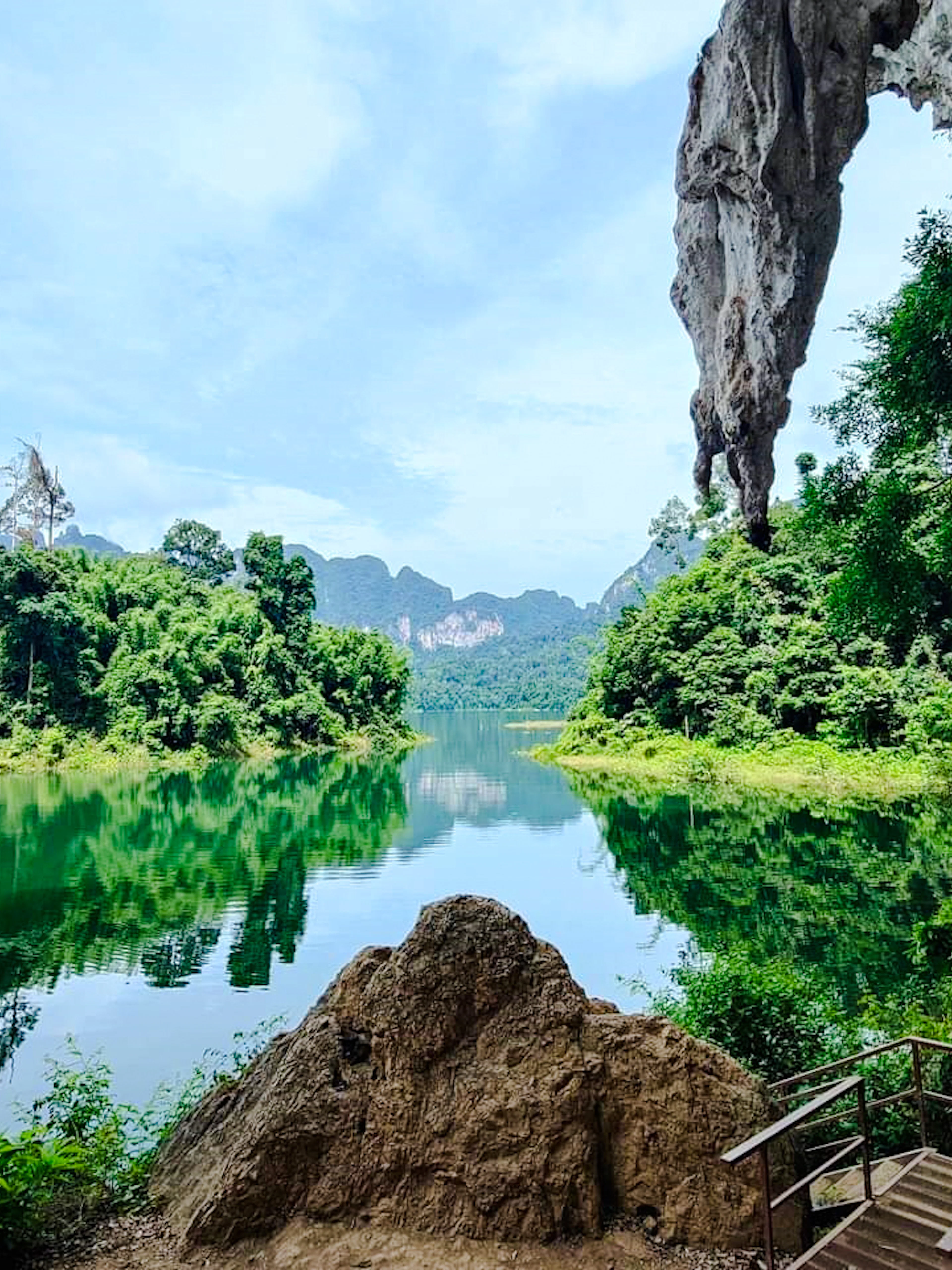 Cheow Lan Lake view with limestone cliffs and lush greenery in Khao Sok National Park, Krabi.