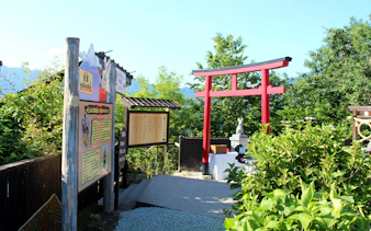 Torii gate and informational signs at Fuji Panoramic Ropeway, Yamanashi Prefecture, Japan.