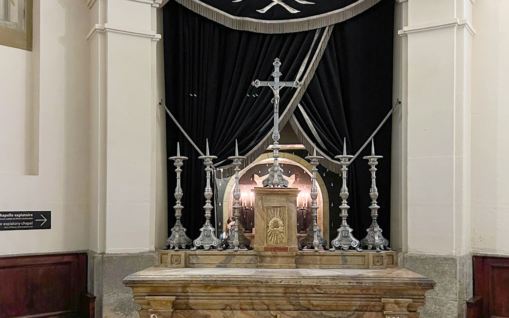Altar with silver candlesticks and cross in Sainte Chapelle, Paris.