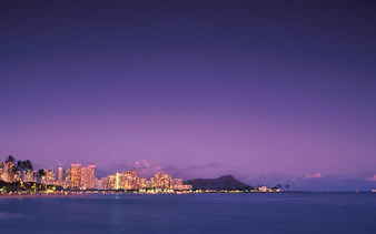 Honolulu skyline at dusk with Diamond Head in view, Hawaii.