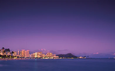 Honolulu skyline at dusk with Diamond Head in view, Hawaii.