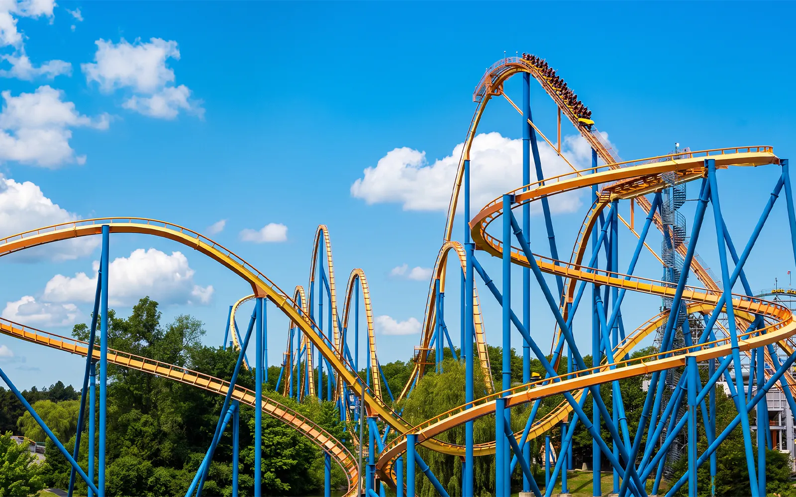 Roller coaster Behemoth at Canada's Wonderland with blue sky backdrop.