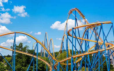 Roller coaster Behemoth at Canada's Wonderland with blue sky backdrop.