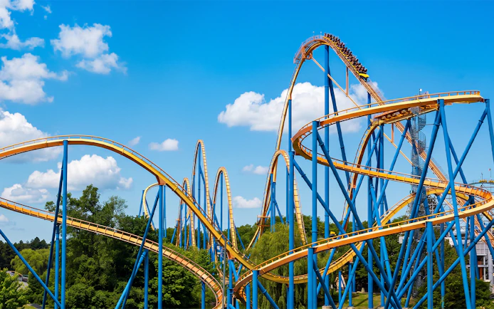 Roller coaster Behemoth at Canada's Wonderland with blue sky backdrop.
