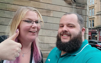 Self-guided city exploration in historic Glasgow with smiling participants.