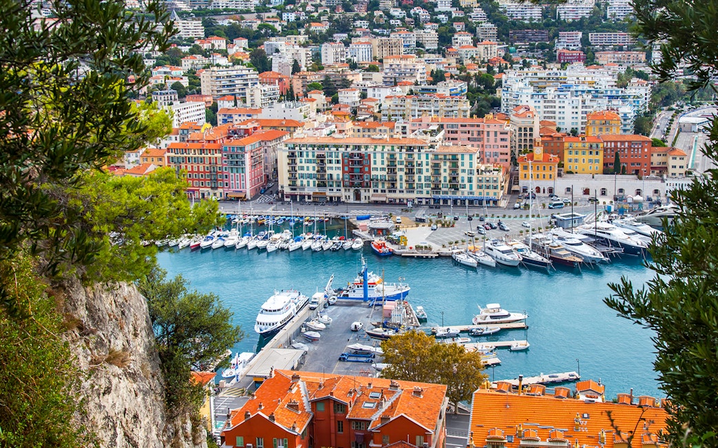 Nice harbor view with colorful buildings and yachts, ideal for a self-guided audio tour.
