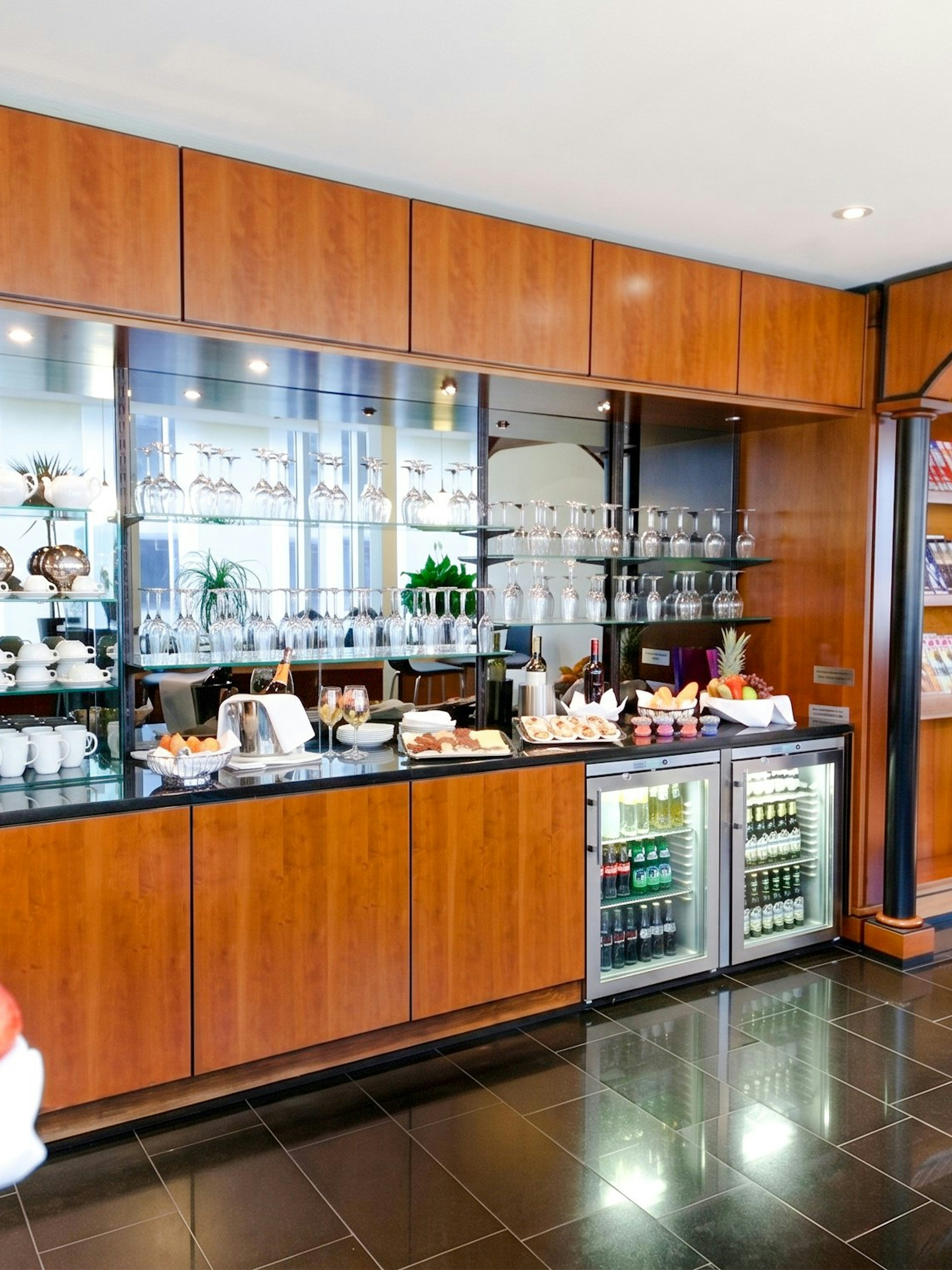 LuxxLounge buffet area with snacks and drinks at Terminal 1, Frankfurt International Airport (FRA).