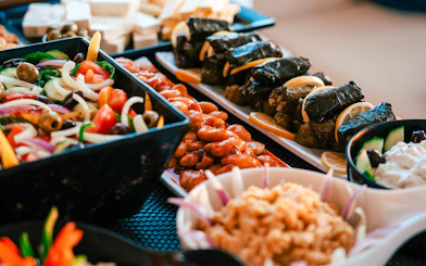 Assorted Greek dishes served on a Santorini luxury catamaran cruise.