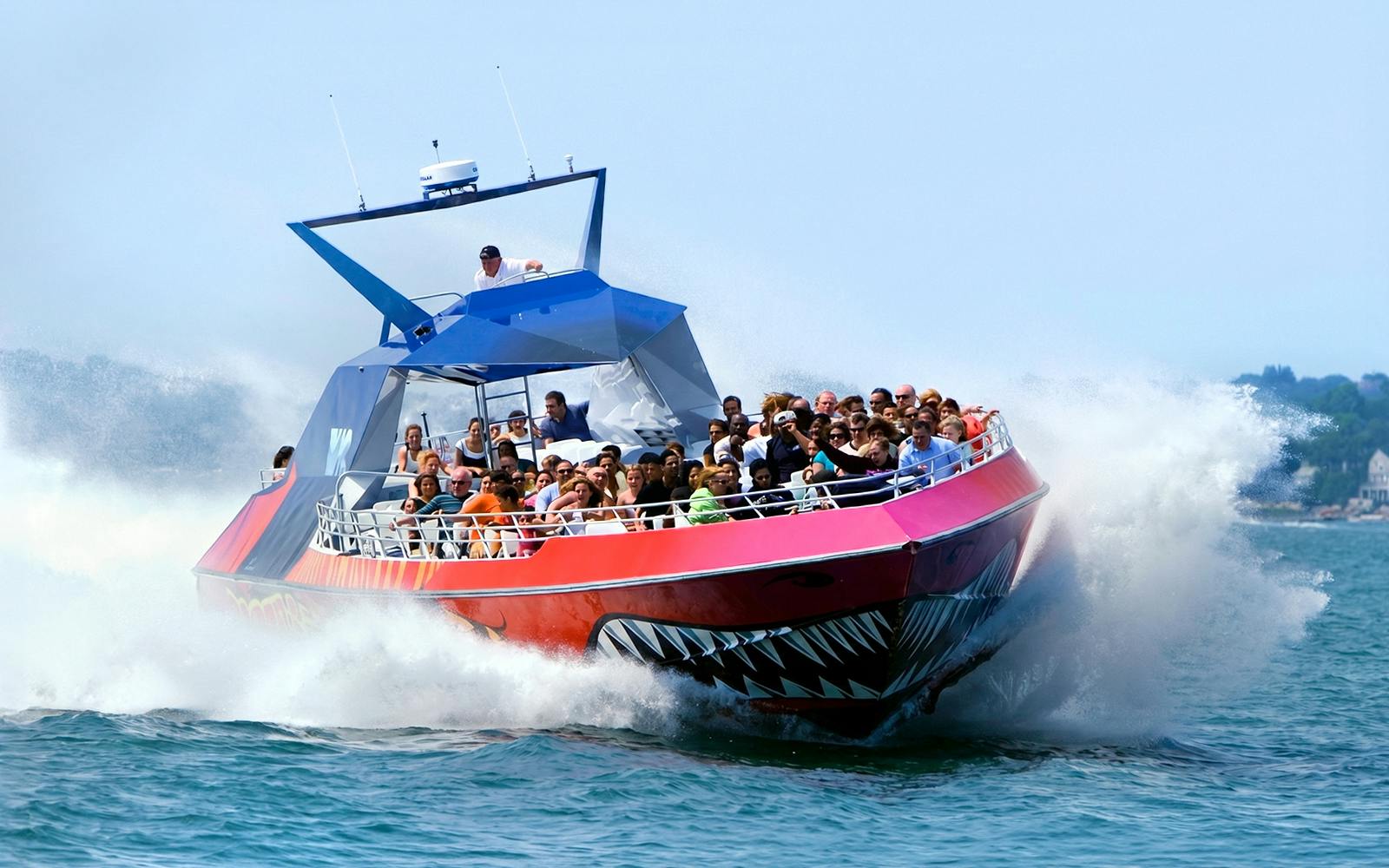 Thrill-seekers on the Codzilla boat ride in Boston, splashing through the water.