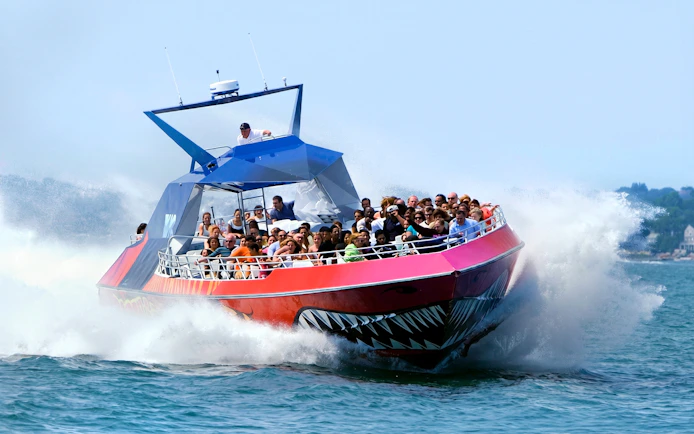 Thrill-seekers on the Codzilla boat ride in Boston, splashing through the water.