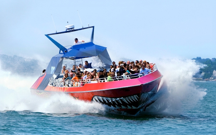 Thrill-seekers on the Codzilla boat ride in Boston, splashing through the water.