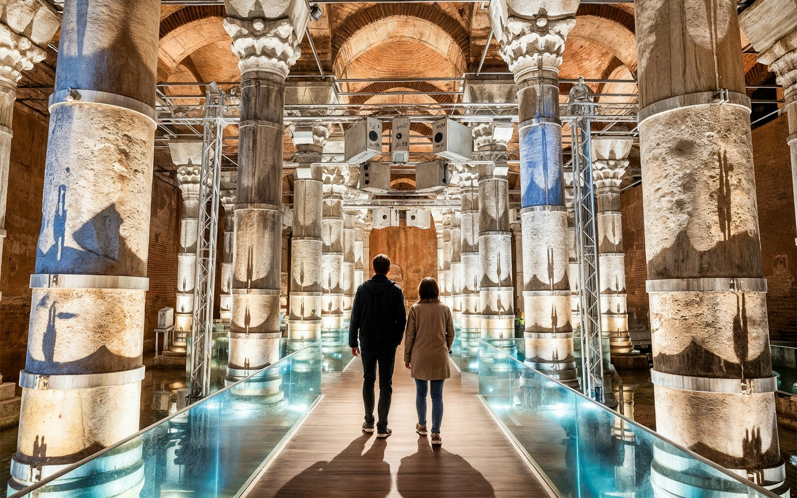 People walking admist 32 original marble columns and vaulted brick ceilings inside Theodosius Cistern