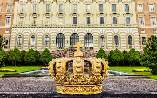 Golden crown sculpture in front of the Royal Palace, Stockholm.
