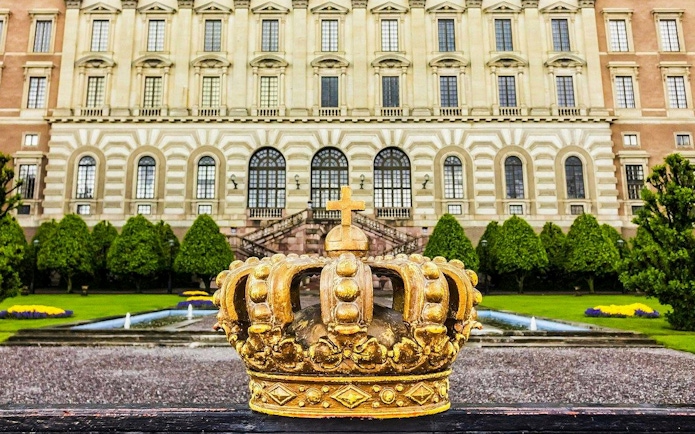Golden crown sculpture in front of the Royal Palace, Stockholm.