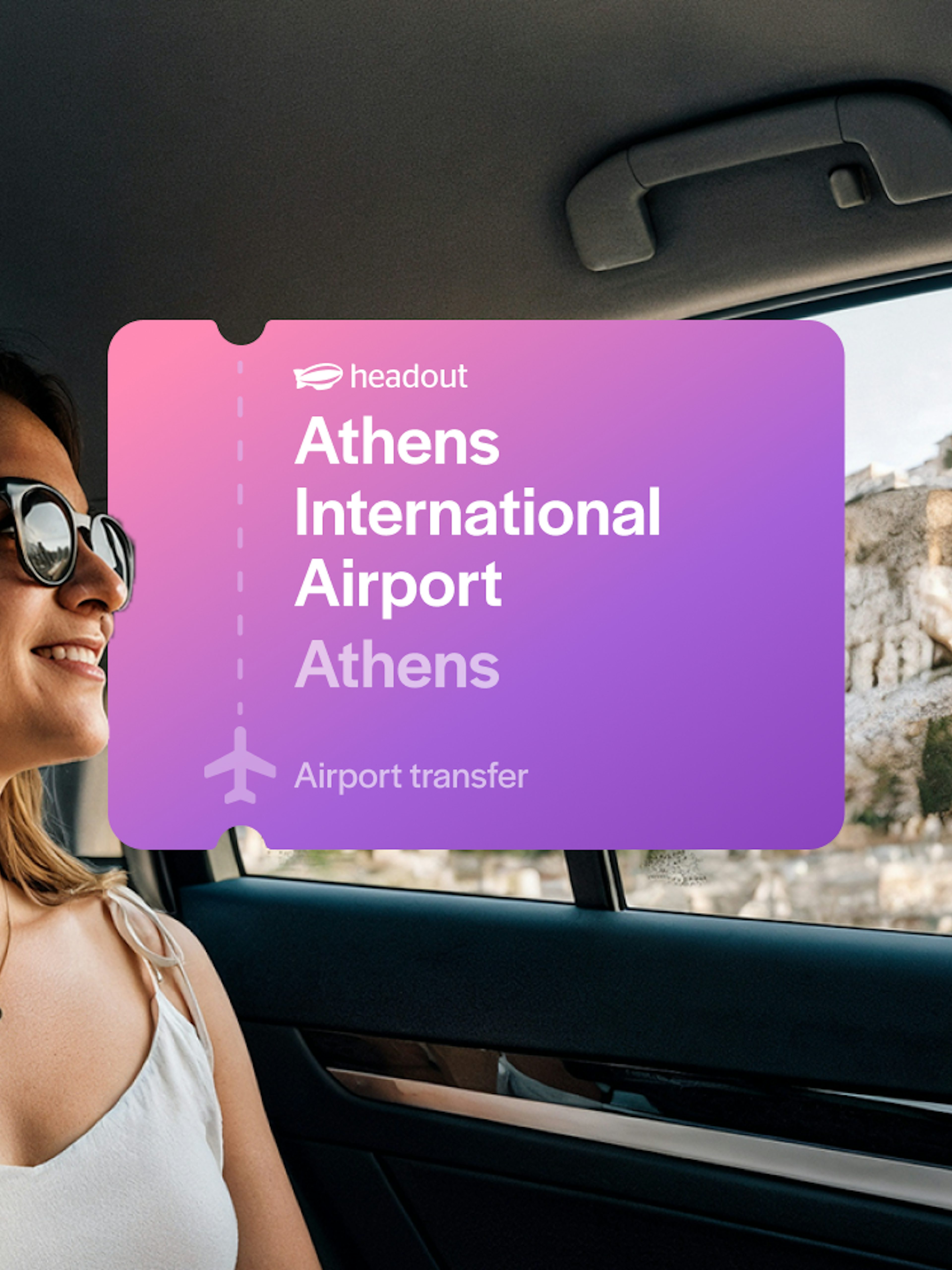 Woman in car with view of Acropolis, Athens International Airport transfer.