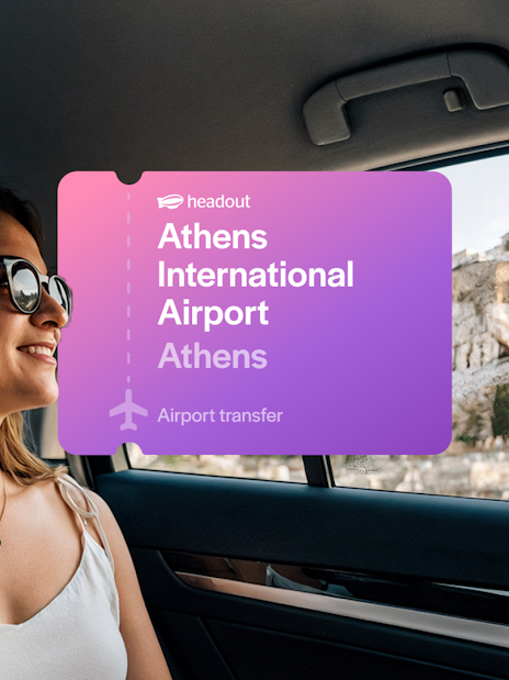 Woman in car with view of Acropolis, Athens International Airport transfer.