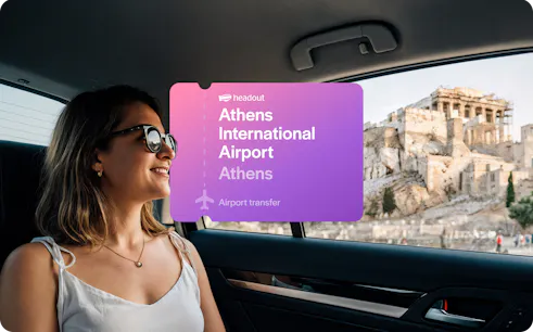 Woman in car with view of Acropolis, Athens International Airport transfer.